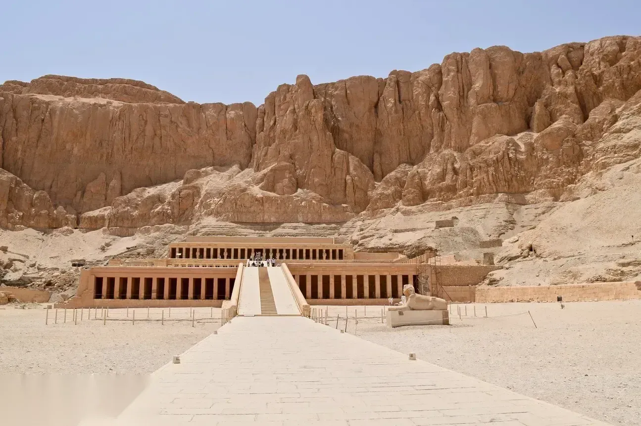 A long paved causeway leads up to the three-tiered Temple of Hatshepsut, built into sheer cliffs at Deir el-Bahari